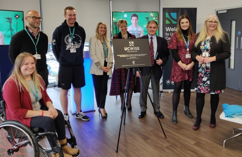 Jack unveiling plaque at new educational facility.