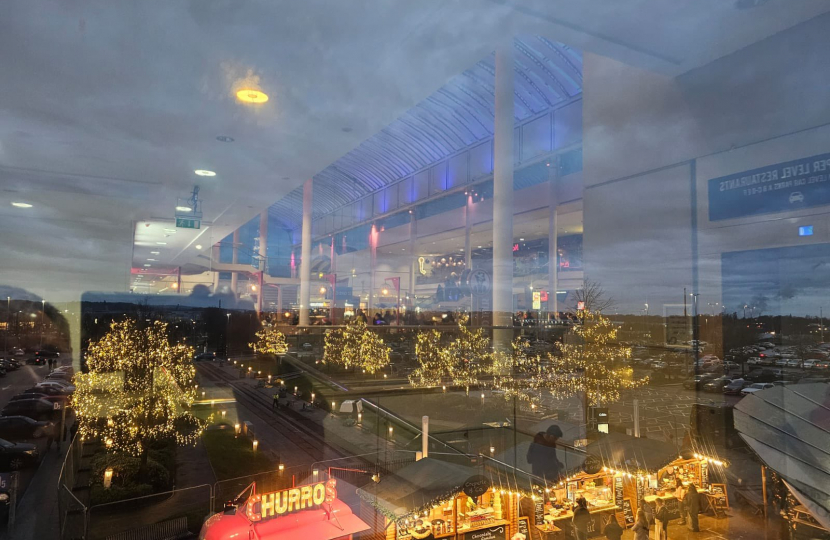 A picture of lit up Christmas Trees at the Mall at Cribbs Causeway.