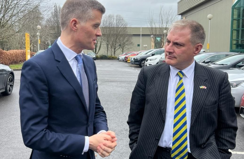 Mark Harper MP and Jack Lopresti MP talking to each other outside DHL in Bradley Stoke.