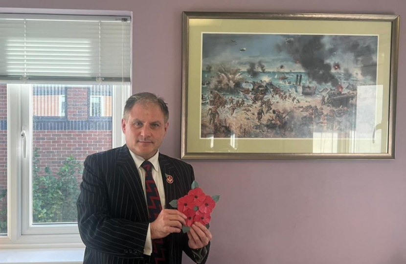 Jack holding the origami poppy display.