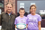 Jack at Clifton Rugby game with Toby, who is fundraising for St Peter's Hospice, and his mum Claire.