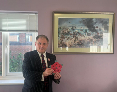 Jack holding the origami poppy display.