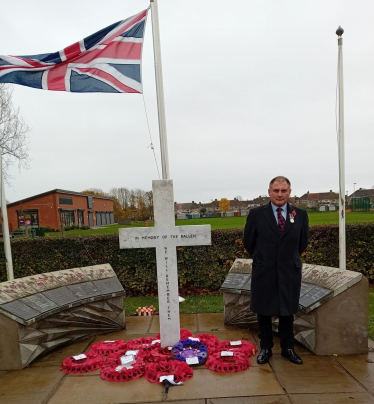 Jack Lopresti MP standing at Patchway War Memorial